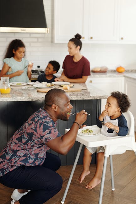 A diverse family enjoys breakfast together in a modern kitchen setting, highlighting love and togetherness.
